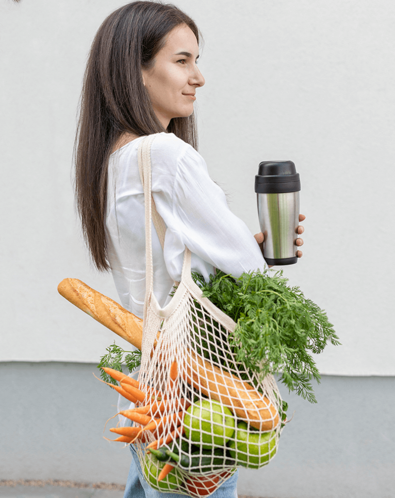 Premium Photo  Hand with an eco paper bag with vegetables.young hipster  lifestyle girl holding paper bag with vegetables. zero waste food shopping.  eco natural concept